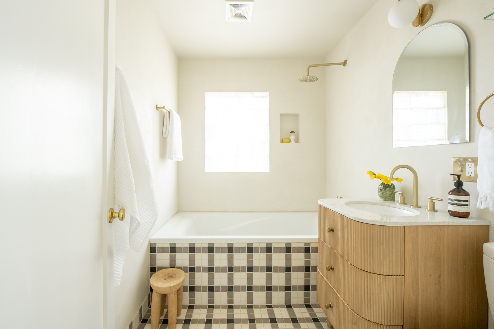 We added a 6-foot soaking tub surrounded by a plaid 2x2 tile design.